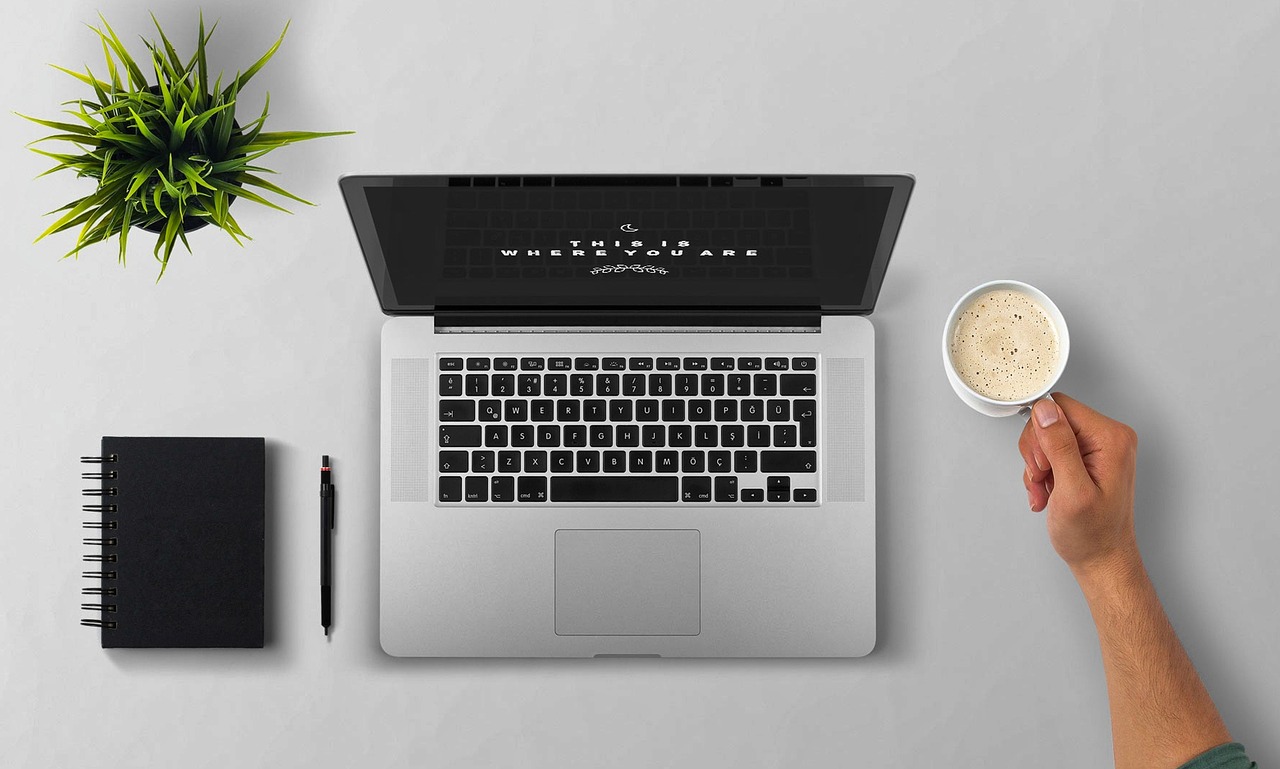 Laptop, coffee, arm — SEXTOANILLO Providing Easy Navigation for Website Features